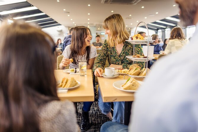 Afternoon Tea River Cruise on the Thames - Inside the Boat: Fixed Tables, Cozy Saloon, and Window View Guarantees