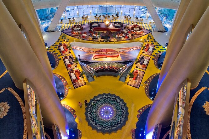 Dubai Burj Al Arab Guided Tour with High Tea Experience. - High tea in the atrium: Sahn Eddar, pastries, tea, and cocktails