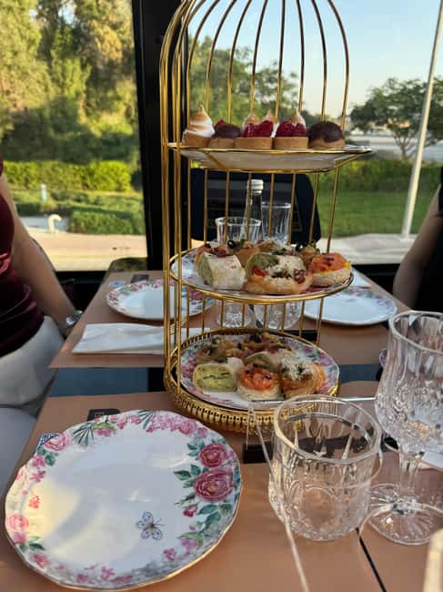 Dubai: Bustronomy Panoramic Afternoon Tea City Tour - The afternoon tea spread: savory first, then sweets