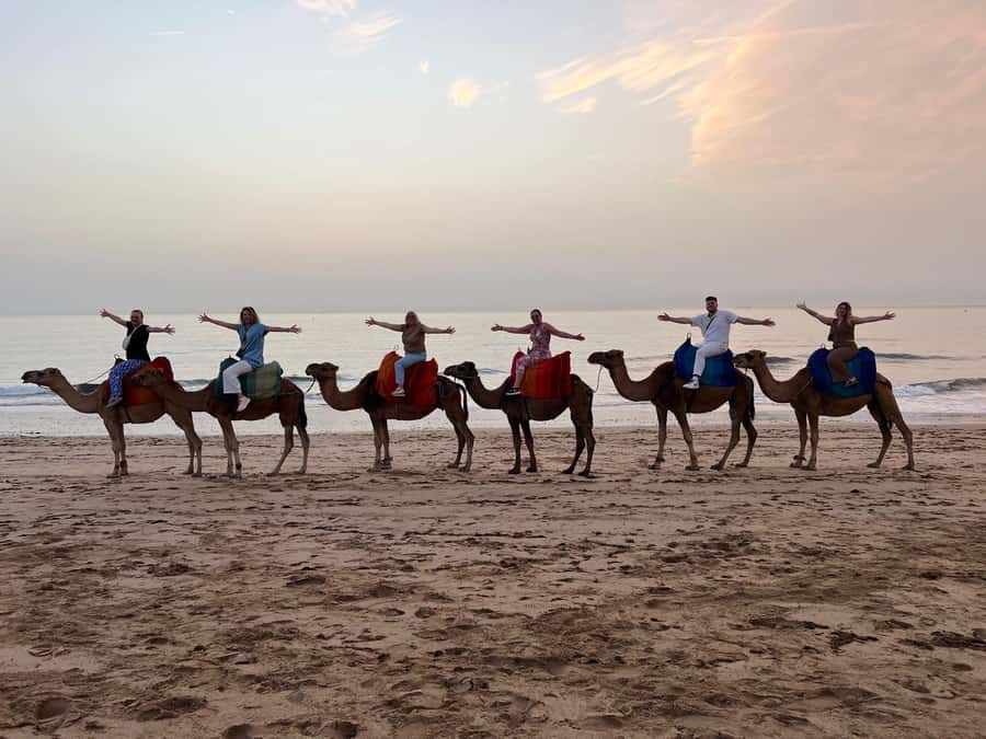Tangier: Sunset, Tea, Sweets, Camel Ride, and Hercules Caves - The beach camel ride at sunset: pure Tangier energy